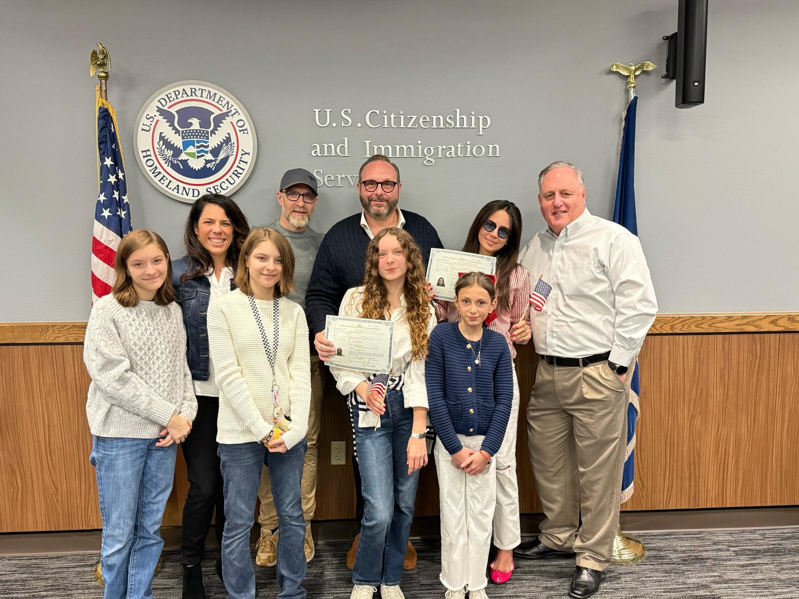 Max with his family at a U.S. Citizenship and Immigration Services ceremony