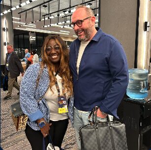 Max with a fellow agent at an SFG event
