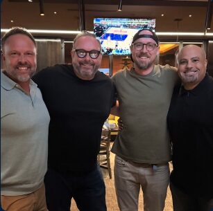 Max with friends in the business